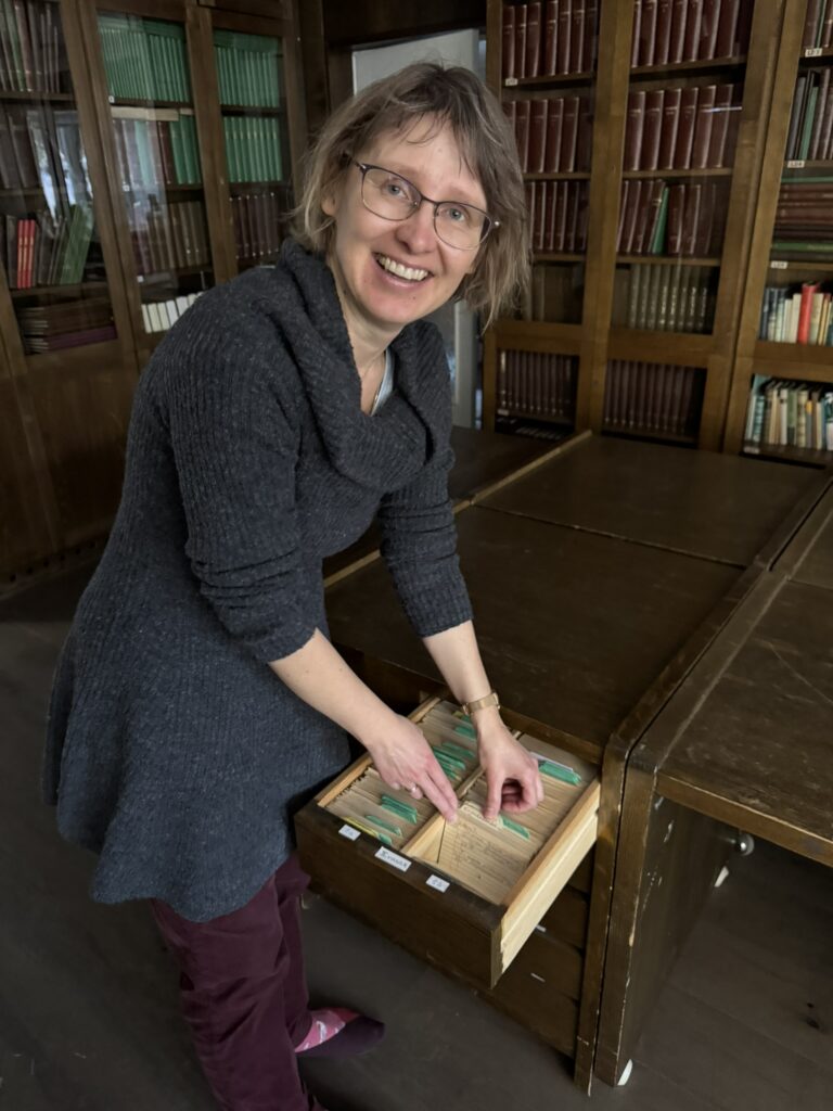 Elle-Mari Talivee, Senior Researcher at the Institute of Literature, demonstrating the museum's card index
